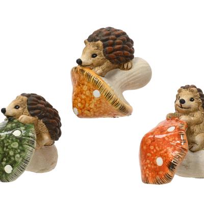 Egel terracotta sitting on mushroom