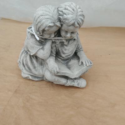Witsteen Jongen & Meisje met boek - D40